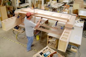 Large wood mantel hood being hand built.