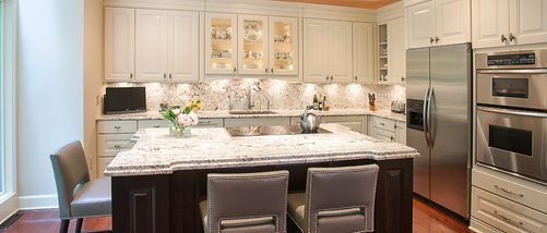 Large remodeled kitchen with island and under cabinetry lighting