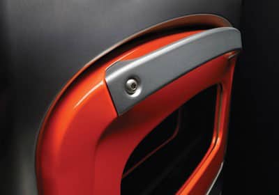 an orange and black car door handle is shown