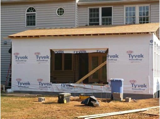 a house under construction with the roof up