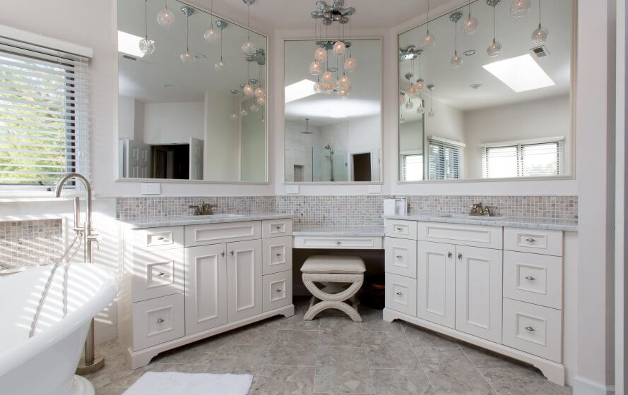 Remodeled bathroom with large double vanity and soak-in tub