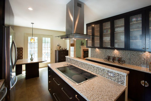 a modern kitchen with granite counter tops and stainless steel appliances