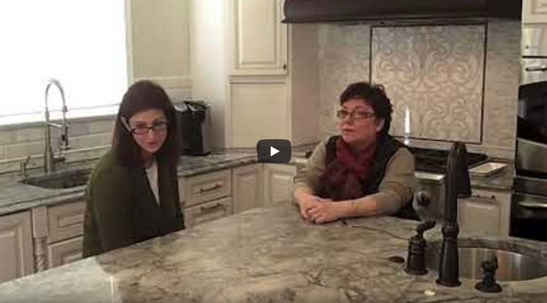 Video thumbnail of two women sitting in a newly renovated kitchen