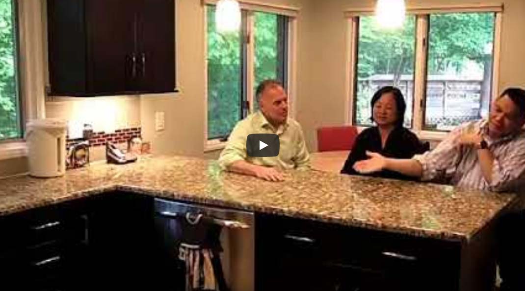 Video thumbnail of three people sitting in a newly renovated kitchen