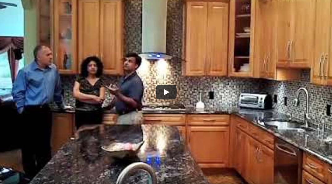 Video thumbnail of three people standing in a newly renovated kitchen