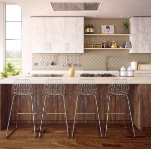 Remodeled kitchen with white cabinetry and built-in seating area with a dark wood base