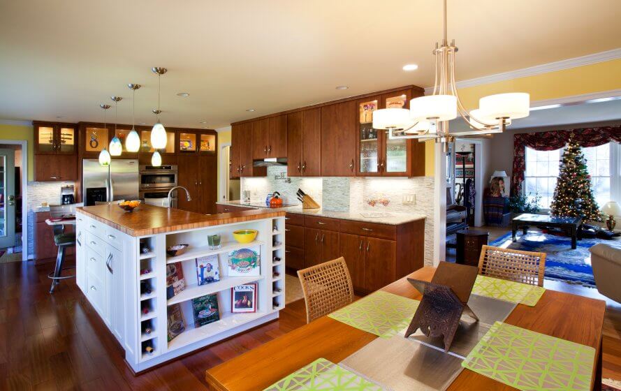 a kitchen with a center island and wooden floors