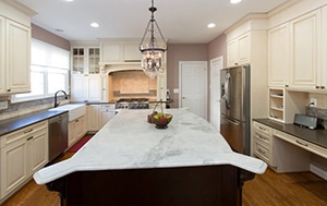 a large kitchen with an island in the middle