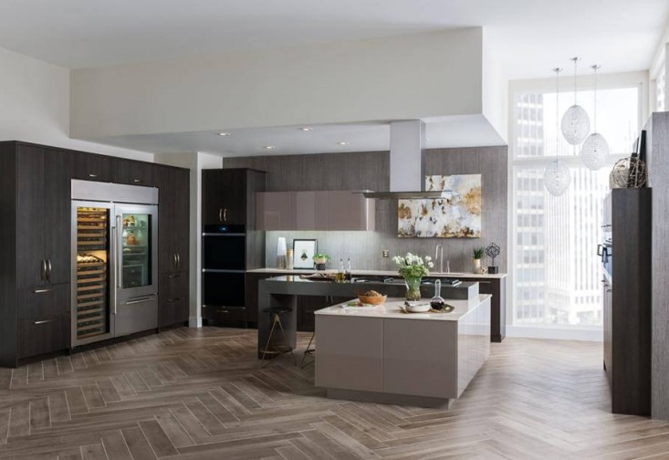 Kitchen with stainless steel appliances and dark and light accents