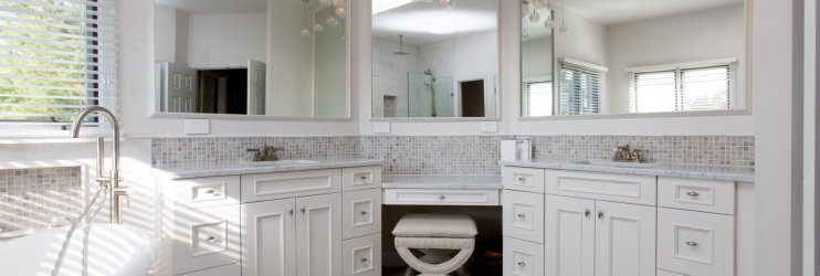 Primary bathroom remodel with a double vanity and white cabinetry