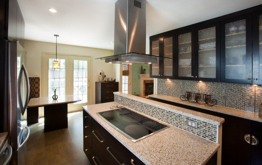 a kitchen with a stove, oven and cabinets