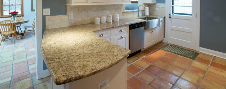 a kitchen with a sink, dishwasher and oven