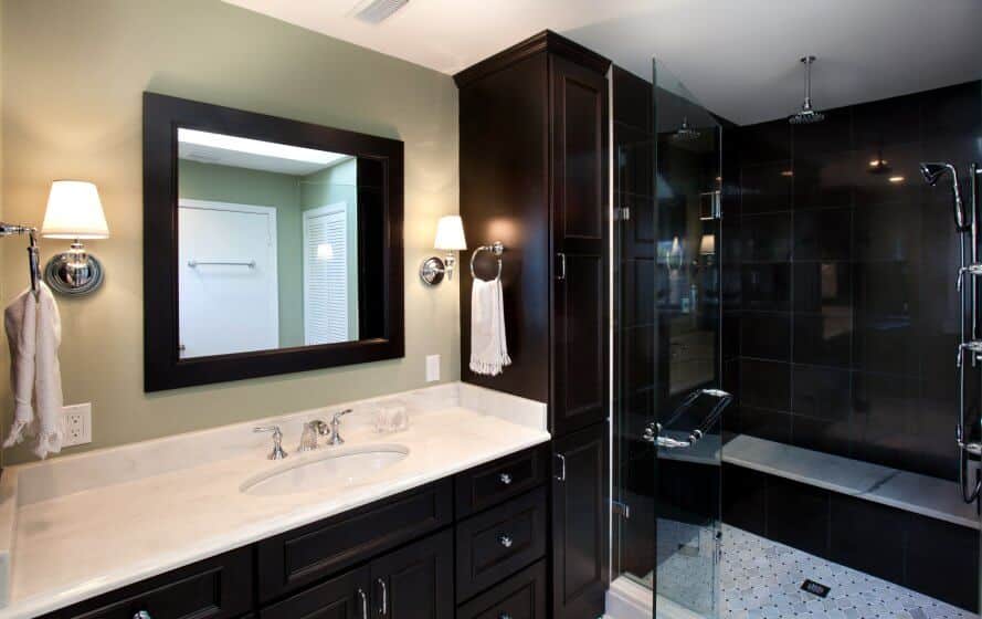 Remodeled bathroom with dark cabinetry