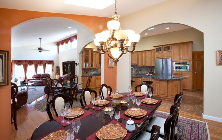 a dinning room table with place settings on it