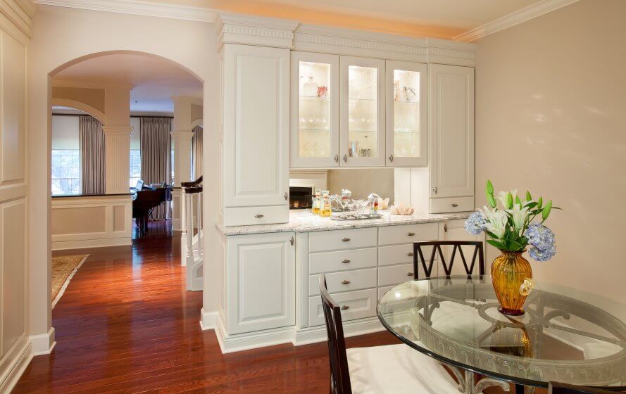 a dining room table with a vase on top of it