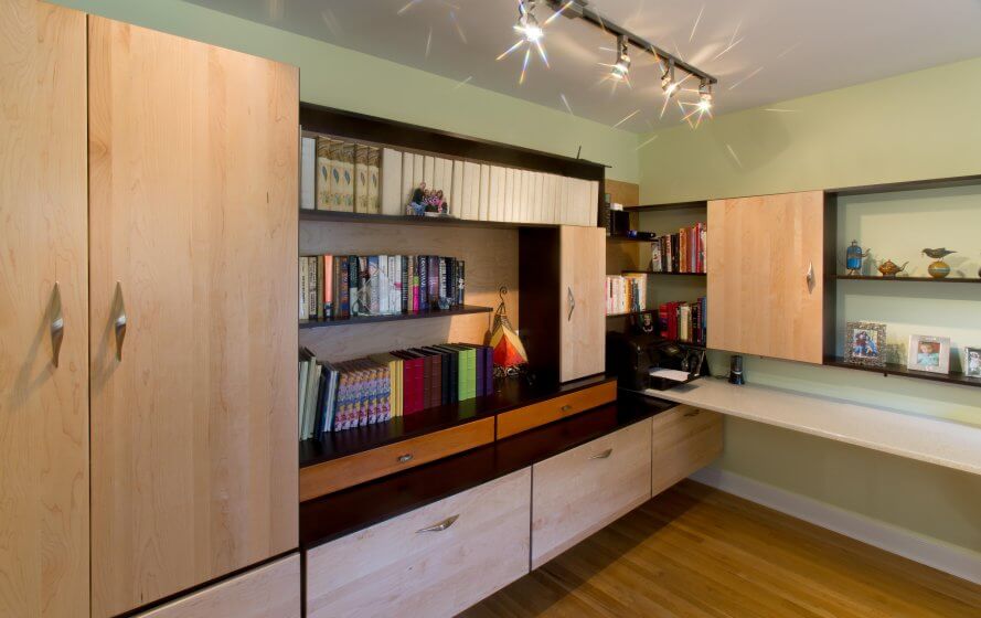 a room with a book shelf, bookshelf and window