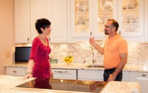 Signature Kitchens Additions & Baths designers discussing kitchen remodel.