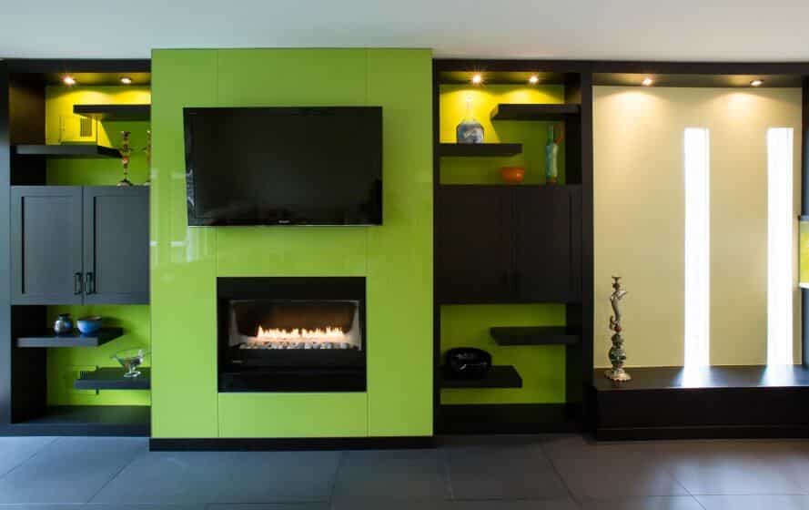 a living room with a fire place and entertainment center