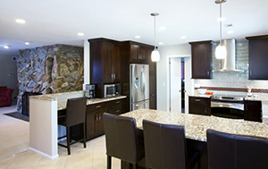 a large kitchen with an island and dining room table