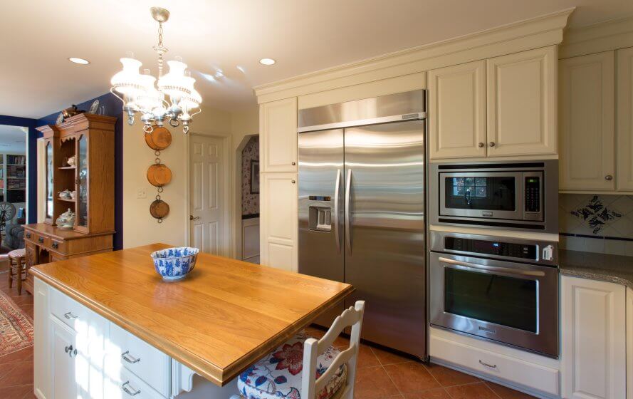 a kitchen with a large wooden counter top