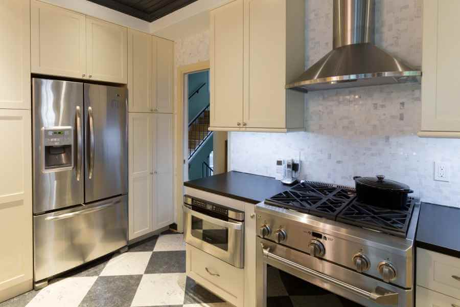 a kitchen with a stove, oven and refrigerator