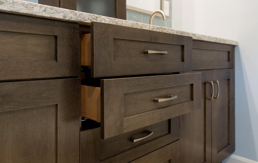 a close up of a bathroom vanity with drawers