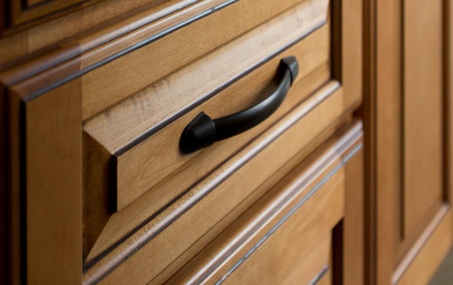 a close up of a drawer handle on a cabinet