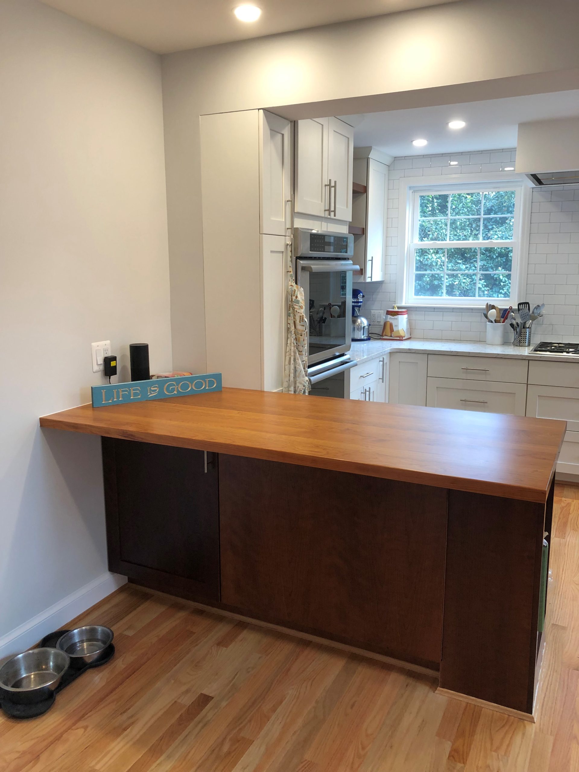 a kitchen with a large wooden counter top