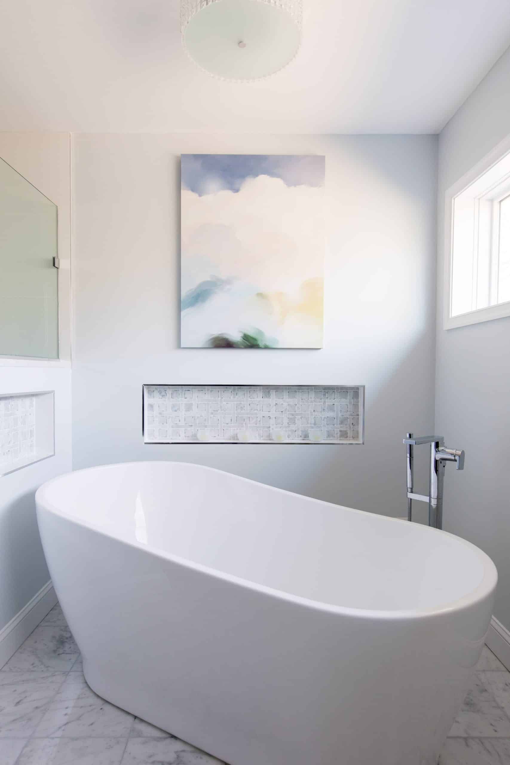 a bathroom with a large white bath tub