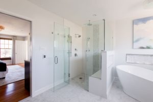 Newly remodeled bathroom in Rockville, MD, with glass-enclosed shower.