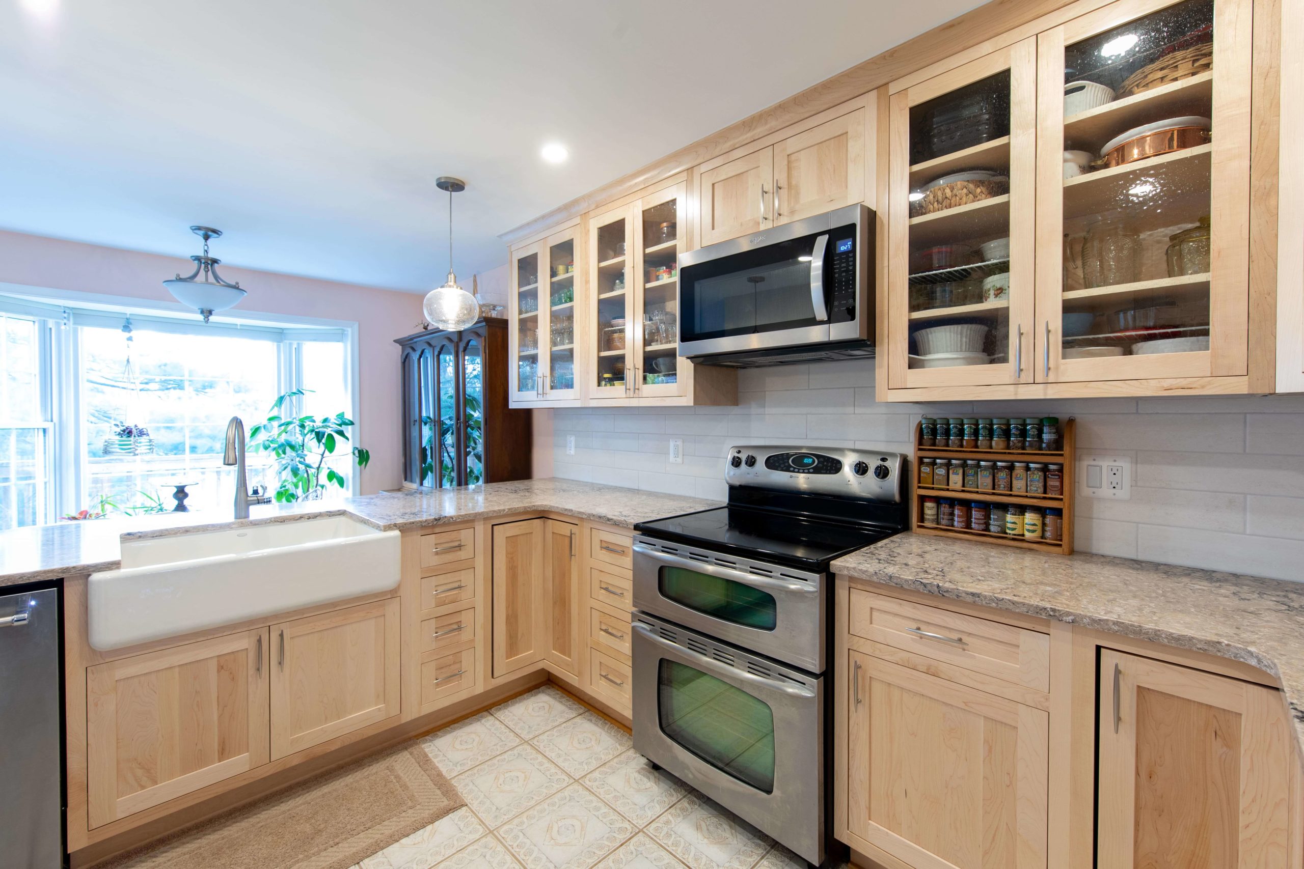 a kitchen with wooden cabinets and stainless steel appliances