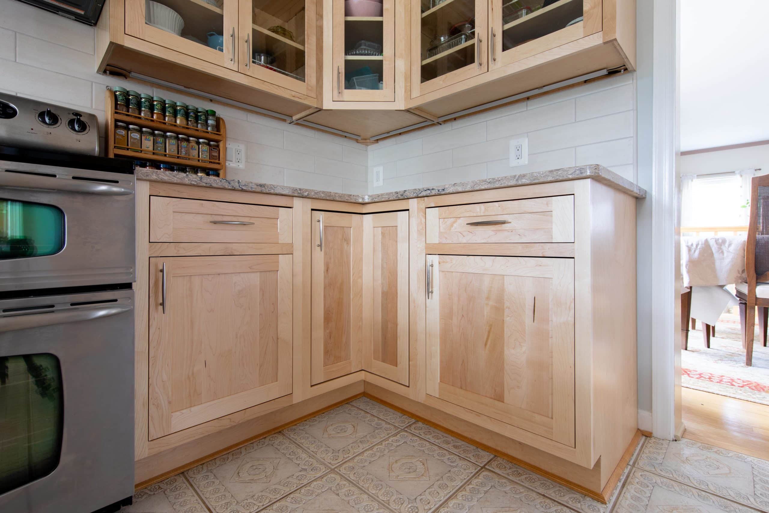 a kitchen with wooden cabinets and stainless steel appliances