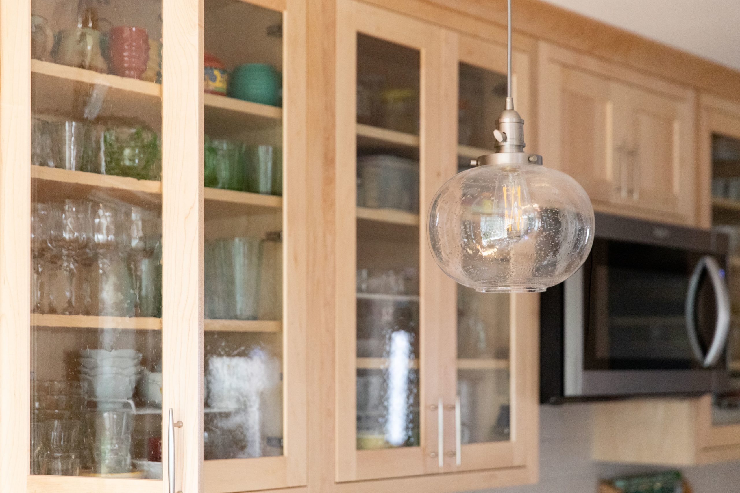 Glass-front cabinets in a remodeled kitchen