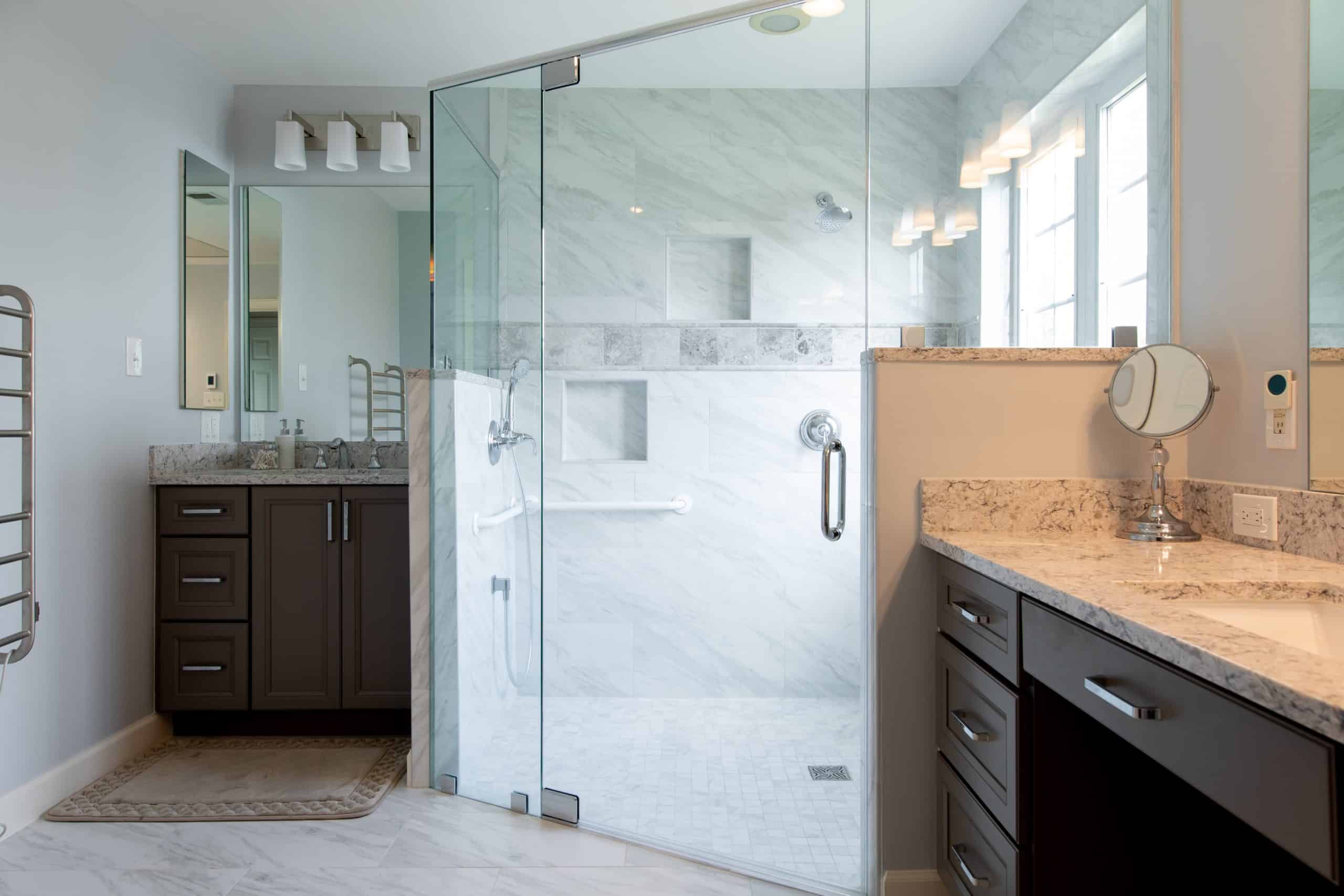 a bathroom with a walk in shower next to a sink