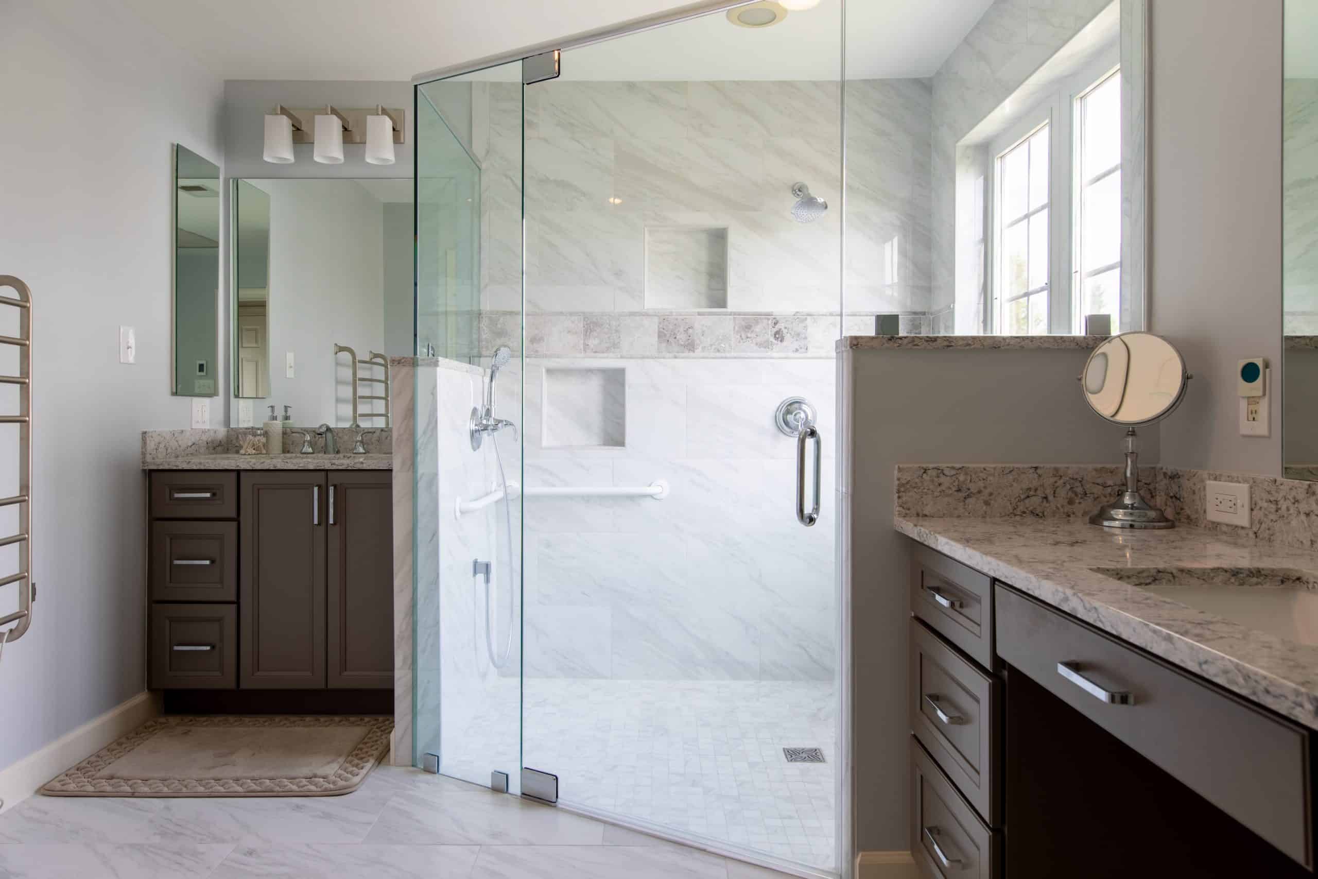 a bathroom with a walk in shower next to a sink